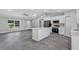 Open-concept living area featuring kitchen with island and appliances at 4314 Se 131St Ln, Belleview, FL 34420