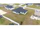 Aerial view of a newly constructed home with white fence and grassy yard at 4415 Sw 169Th Lane Rd, Ocala, FL 34473