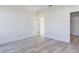 A bedroom featuring wood-look flooring and neutral walls and trim at 4415 Sw 169Th Lane Rd, Ocala, FL 34473