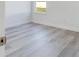 Bedroom displaying a window with exterior views and light-colored floors at 4415 Sw 169Th Lane Rd, Ocala, FL 34473