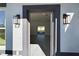 Welcoming entryway boasting modern light fixtures and a glimpse into the bright, open-concept living area at 4415 Sw 169Th Lane Rd, Ocala, FL 34473