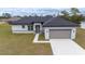 New single-story home featuring a two-car garage and a modern design in a serene neighborhood at 4415 Sw 169Th Lane Rd, Ocala, FL 34473