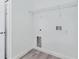 Laundry room with wood-look flooring and hookups for a washer and dryer at 4415 Sw 169Th Lane Rd, Ocala, FL 34473