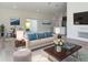 Beautifully staged living room featuring modern decor and an open layout, leading to the dining area at 4415 Sw 169Th Lane Rd, Ocala, FL 34473