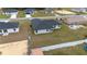 Aerial view showcasing the home's backyard and simple, white exterior design with a dark roof at 4415 Sw 169Th Lane Rd, Ocala, FL 34473