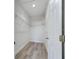 Walk-in closet with wood-look flooring and wire shelving providing ample storage space at 4415 Sw 169Th Lane Rd, Ocala, FL 34473