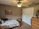Relaxing bedroom with a cozy bed, soothing colors, and ample closet space at 5024 Se 107Th Pl, Belleview, FL 34420
