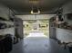Open garage offering an exterior view of the house and driveway, providing convenient access and parking space at 5024 Se 107Th Pl, Belleview, FL 34420