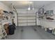 This garage provides ample storage space with shelving and room for organizing tools and household items at 5024 Se 107Th Pl, Belleview, FL 34420