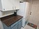 The kitchen features good cabinet space and modern appliances at 5024 Se 107Th Pl, Belleview, FL 34420