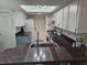 Functional kitchen with updated appliances, ample counter space, and a bright skylight for natural light at 5024 Se 107Th Pl, Belleview, FL 34420