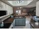 Open-concept kitchen with modern appliances that flows into the dining area and living room, ideal for entertaining at 5024 Se 107Th Pl, Belleview, FL 34420