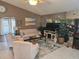 This beautiful living room is well decorated with plants, art and comfortable furniture at 5024 Se 107Th Pl, Belleview, FL 34420