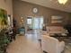 The living room is spacious and has a relaxing vibe and tile floors at 5024 Se 107Th Pl, Belleview, FL 34420