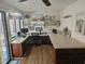 Functional home office with built-in shelves, large windows, and neutral decor at 5024 Se 107Th Pl, Belleview, FL 34420