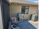 Outdoor patio with a stainless steel grill and table, providing an inviting space for outdoor cooking and entertaining at 5024 Se 107Th Pl, Belleview, FL 34420