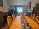 The dining room features a dining table with chairs, fireplace, and Christmas decorations at 516 Marion Oaks Dr, Ocala, FL 34473