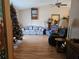 Cozy living room with a floral sofa, plush recliners, and a ceiling fan at 516 Marion Oaks Dr, Ocala, FL 34473