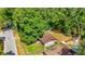 Aerial shot showcases the home's location among mature trees and local streets at 5737 Nw 65Th Pl, Ocala, FL 34482