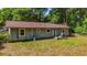 Back exterior of the property highlighting the home's simple design and surrounding yard at 5737 Nw 65Th Pl, Ocala, FL 34482