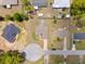 A birds eye aerial shot of the property and surrounding neighborhood at 60 Hemlock Trl, Ocala, FL 34472