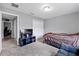 Neutral bedroom with carpet, closet, TV, and natural light at 60 Hemlock Trl, Ocala, FL 34472