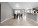Spacious dining room area with decorative lighting and views into the kitchen at 60 Hemlock Trl, Ocala, FL 34472