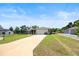 Charming single-story home with attached two-car garage and long driveway at 60 Hemlock Trl, Ocala, FL 34472