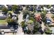 An aerial view shows a charming home with mature trees and garage at 743 E Fort King St, Ocala, FL 34471