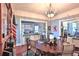 Dining room with hardwood floors opens to kitchen and living room, ideal for entertaining at 743 E Fort King St, Ocala, FL 34471