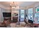 Elegant living room featuring a fireplace, stained glass window, and custom lighting at 743 E Fort King St, Ocala, FL 34471