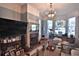 Elegant living room featuring a fireplace, stained glass window, and custom lighting at 743 E Fort King St, Ocala, FL 34471