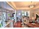 Open floor plan with view of kitchen and dining areas, hardwood floors, and decorative lighting at 743 E Fort King St, Ocala, FL 34471