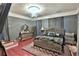 Elegantly furnished main bedroom with plush bedding, chandelier, and stylish decor at 743 E Fort King St, Ocala, FL 34471
