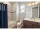 Inviting bathroom featuring a combination shower and tub, modern fixtures, and an elegant vanity for a relaxing experience at 8457 Sw 97Th Cir, Ocala, FL 34481