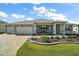 Well-maintained single-story home with landscaped front yard and a spacious two-car garage at 8457 Sw 97Th Cir, Ocala, FL 34481