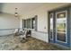 Inviting front porch with stylish seating area and a decorative front door at 8457 Sw 97Th Cir, Ocala, FL 34481