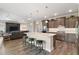 Contemporary kitchen with a center island, bar seating, and stainless steel appliances at 8457 Sw 97Th Cir, Ocala, FL 34481