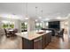 Spacious kitchen with island, seamlessly flowing into the dining and living areas at 8457 Sw 97Th Cir, Ocala, FL 34481