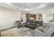 Cozy living room with open layout views of kitchen, comfortable seating arrangement, and bright natural lighting at 8457 Sw 97Th Cir, Ocala, FL 34481