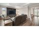 Bright living room featuring a built-in entertainment center and coffered ceiling at 8457 Sw 97Th Cir, Ocala, FL 34481