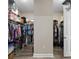 Spacious walk-in closet with ample shelving and hanging space for optimal storage, providing organization and convenience at 8457 Sw 97Th Cir, Ocala, FL 34481