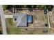 Aerial view showcases a well-maintained backyard with a screened pool and fenced perimeter at 9940 Sw 45Th Ave, Ocala, FL 34476