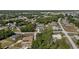 Aerial view of the house showcasing its location in the neighborhood surrounded by trees and other residences at 9940 Sw 45Th Ave, Ocala, FL 34476