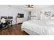 Bright bedroom featuring stylish furnishings, hardwood flooring, and a ceiling fan at 9940 Sw 45Th Ave, Ocala, FL 34476