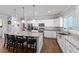 Spacious kitchen featuring an island with seating and stainless steel appliances at 9940 Sw 45Th Ave, Ocala, FL 34476