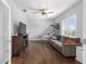 Cozy living room featuring hardwood floors, neutral colors, and a ceiling fan at 9940 Sw 45Th Ave, Ocala, FL 34476