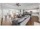 Open-concept living room and kitchen area featuring wood-look tile floors at 9940 Sw 45Th Ave, Ocala, FL 34476