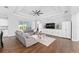 Comfortable living room space with wood-look tile floors, neutral paint and furniture at 9940 Sw 45Th Ave, Ocala, FL 34476