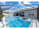 Inviting screened-in pool with sun shelf, toys, and ample space for relaxing and entertaining on a sunny day at 9940 Sw 45Th Ave, Ocala, FL 34476